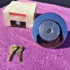 NOS locking gas cap with keys for 1974 1975 Chevrolet Vega Monza part numbers 994631 995213 OEM fuel cap