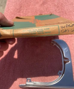 NOS gas door guard for 1961 Chevrolet Nomad station wagon SS part number 985027 OEM fuel filler protection trim