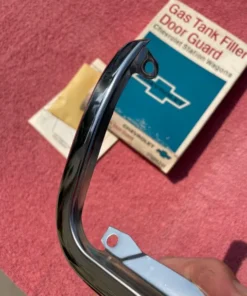 NOS gas door guard for 1965 1966 Chevrolet station wagon part number 986241 OEM fuel filler protection trim