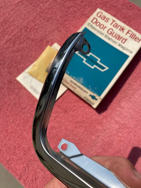 NOS gas door guard for 1965 1966 Chevrolet station wagon part number 986241 OEM fuel filler protection trim