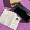 NOS black underseat tissue dispenser for 1970s Chevrolet Impala Caprice pickup truck bench seat part number 994664 OEM accessory