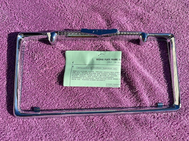 NORS bowtie license plate frame for 1957 Chevrolet Bel Air 210 150 vintage Chevy rear trim accessory