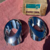 NOS rear exhaust tip bezel trim pair for 1966 1967 Chevrolet Corvette C2 Sting Ray part numbers 3892225 and 3892226 OEM left and right trim