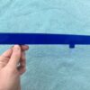 Close-up of blue hood ornament insert for 1947 1948 Chevrolet, new accessory replacement part for classic car restoration