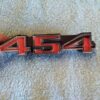 NOS Chevrolet 454 engine emblem big block badge cast numbers 6262348 3986991 vintage GM emblem