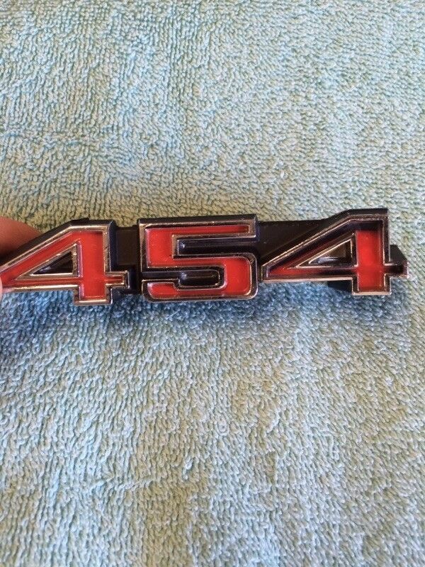 NOS Chevrolet 454 engine emblem big block badge cast numbers 6262348 3986991 vintage GM emblem
