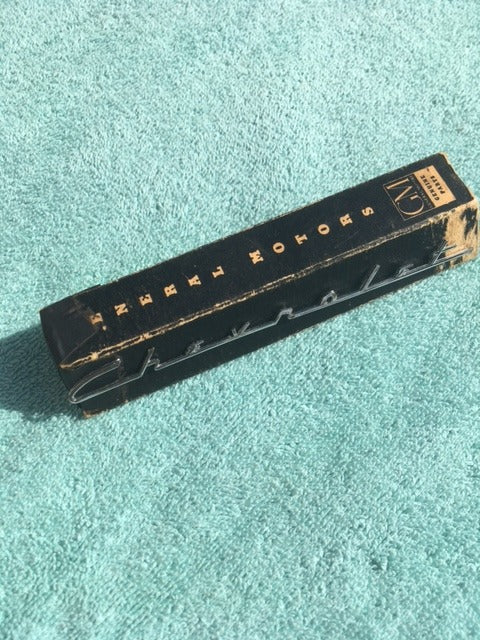 NOS Chevrolet speaker emblem script for 1955 1956 Chevy 150 210 dashboard trim badge