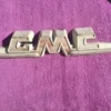 1955 1959 GMC Pickup Suburban Panel Truck original hood emblem excellent used condition authentic vintage GMC restoration trim part.