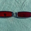 1941 - 1948 Chevrolet Fleetline 4-door sedan NOS Guide Tail Light Lamp Lenses / Bezels #5930829/5930830