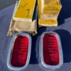 1960-1966 Chevrolet Fleetside Pickup Truck NOS Tail Light Lamp Lens + Bezel Pair #5952677 / 3763570