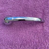 1939 1948 Chevrolet Chevy passenger car NORS inside chrome door handle with retaining clip replacement for OEM part number 4102254 vintage interior restoration component.