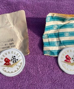 1956 1957 Chevrolet Corvette C1 NOS Hood and Trunk Deck Lid Emblem Pair Part Number 3725754 genuine GM crossed flags restoration emblems for classic Corvette projects.