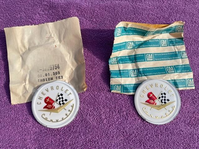 1956 1957 Chevrolet Corvette C1 NOS Hood and Trunk Deck Lid Emblem Pair Part Number 3725754 genuine GM crossed flags restoration emblems for classic Corvette projects.