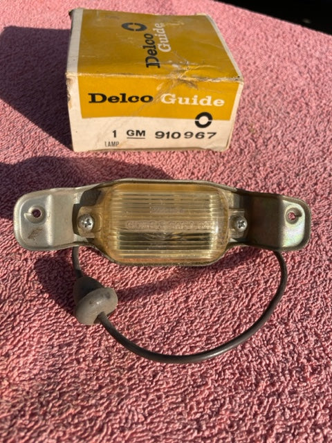 1966-1971 Chevrolet NOS Delco GUIDE License Plate Lamp Lens Assembly #910967